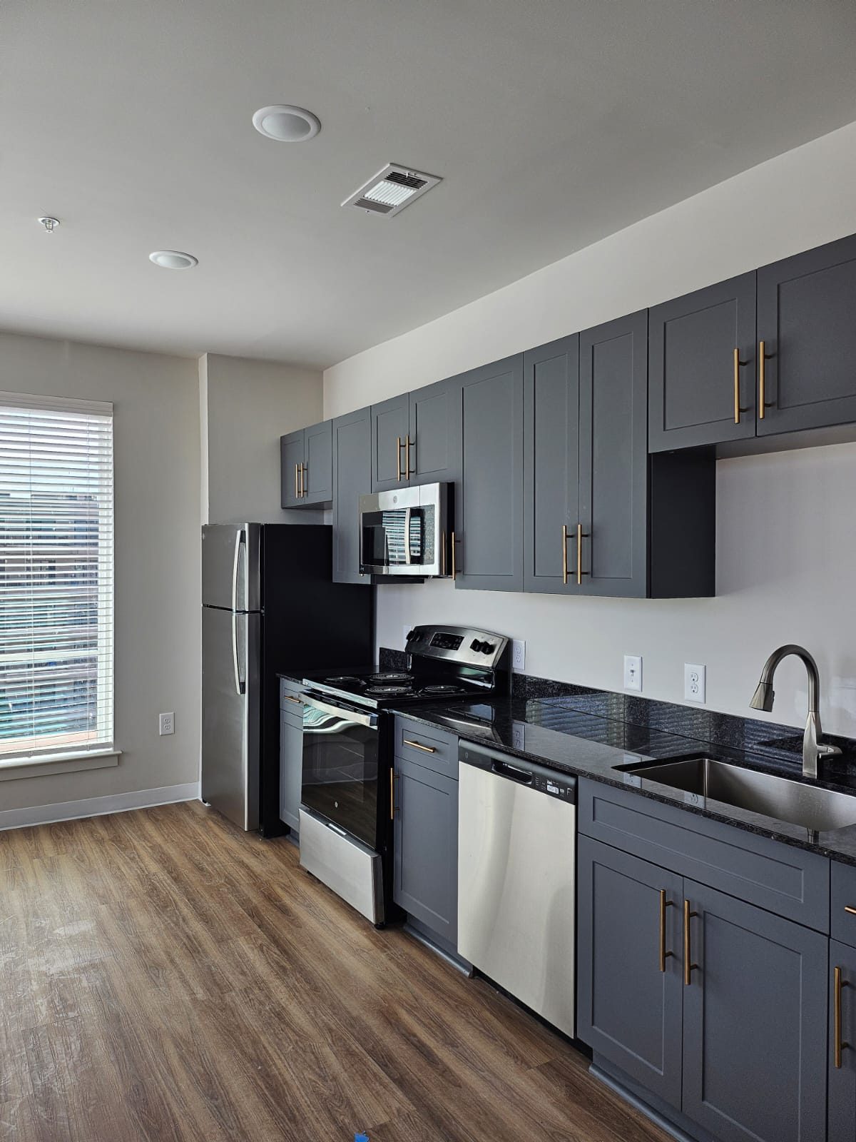 A grey shaker apartment kitchen supplied by Cabo