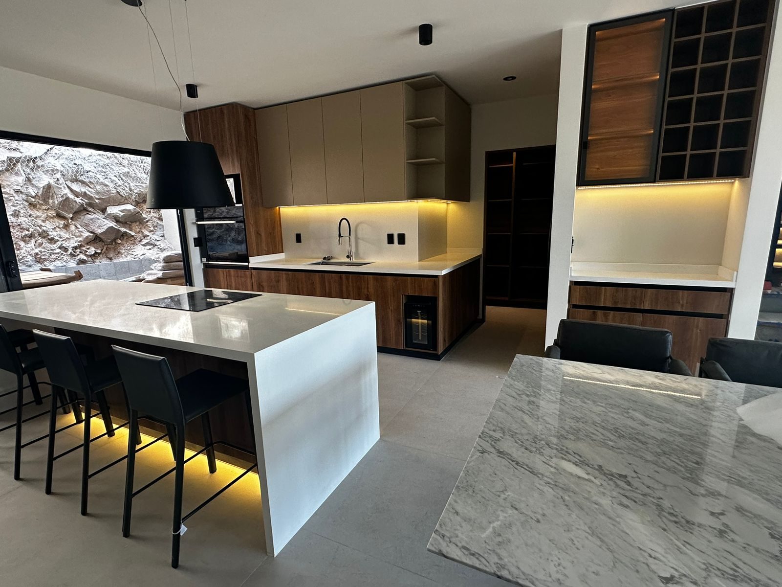 A contemporary wood and stone kitchen supplied by Cabo